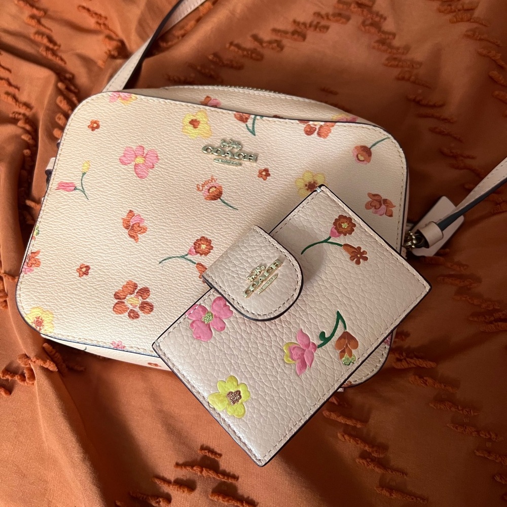 Coach pink floral camera bag crossbody. With according wallet